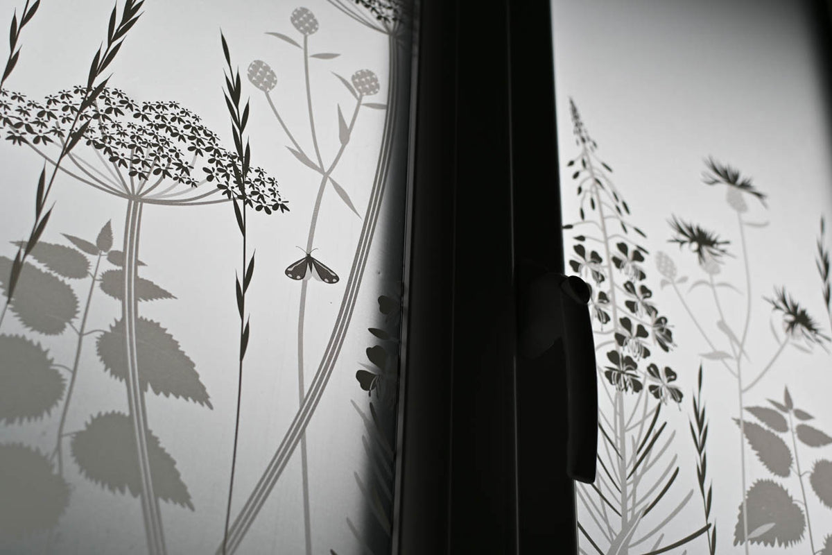 Frosted privacy window film with plants and foliage as part of the design.