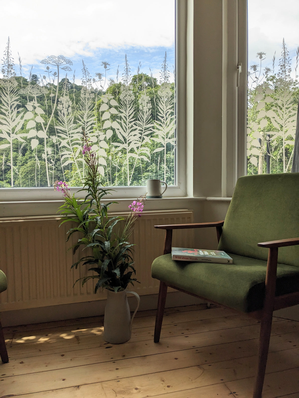 Decorative floral pattern window film design applied to glazing in a seating area.